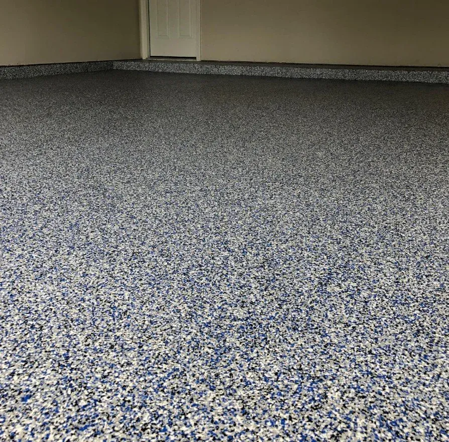 Empty room with gray speckled carpet and beige walls