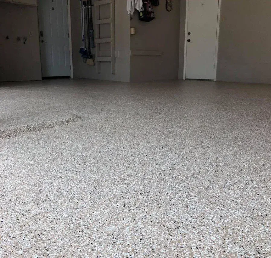 Empty carpeted room with white walls and doors, viewed from a low angle