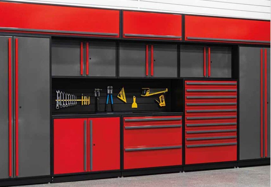 A professional red and gray ProSlat FusionPlus cabinet system featuring a central tool display wall, ideal for organized and accessible garage storage.  Available at Global Garage Flooring & Design of Houston