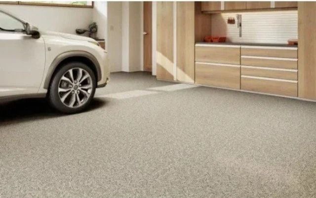 See a premium polyaspartic garage upgrade in Torginol flakes showcasing a seamless tan decorative flake floor finish