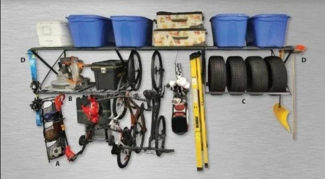 Wall-mounted garage tool organizer with blue bins, tires, ropes, and hand tools arranged on a rack.