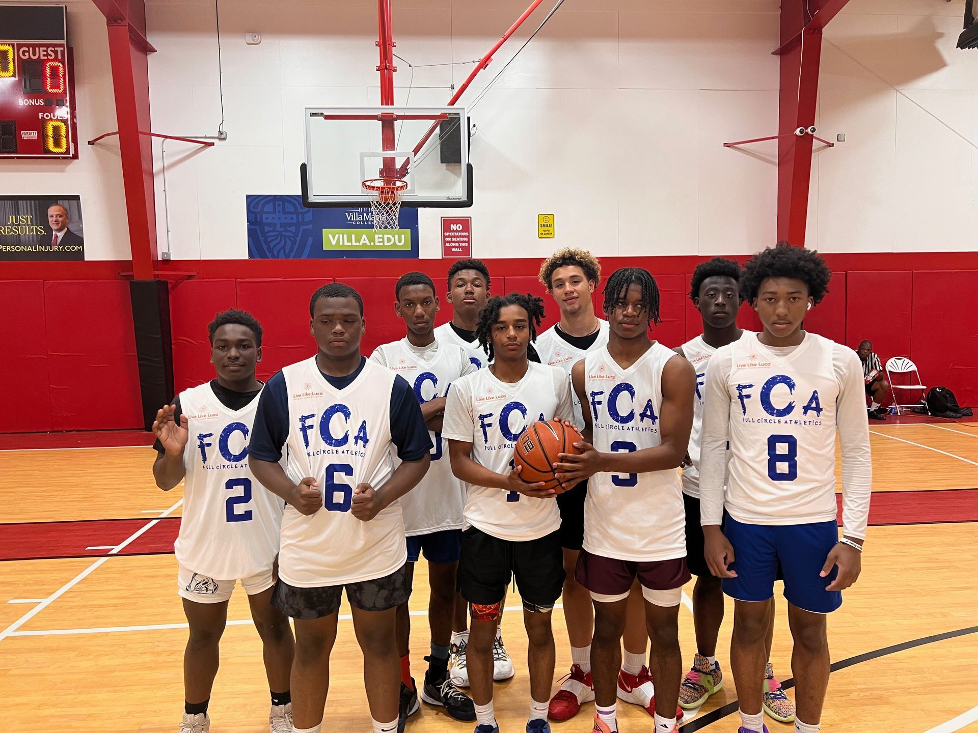 Basketball team in white jerseys with 