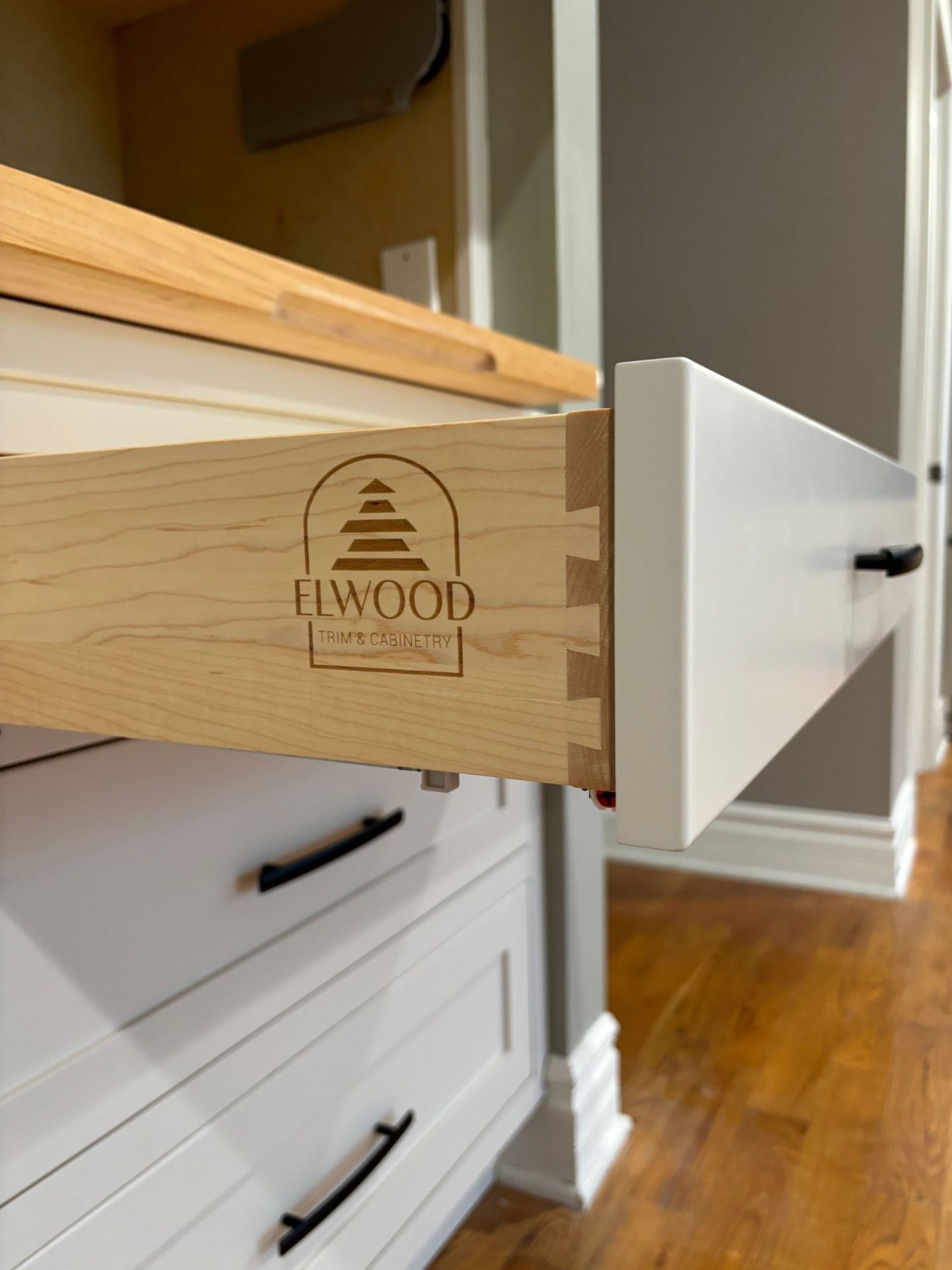 Open white kitchen drawer, dovetailed wooden frame, 