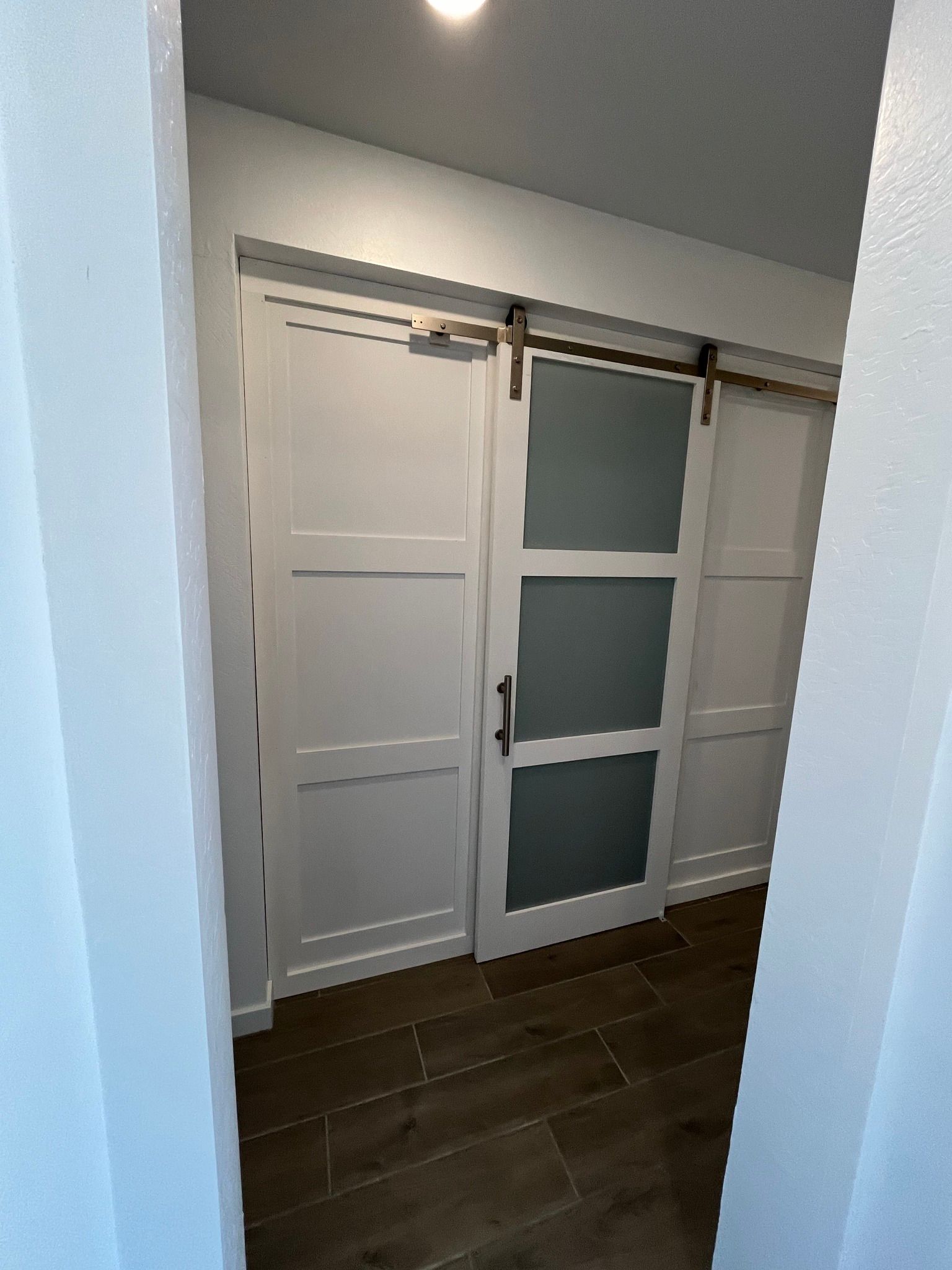 There is a sliding barn door in the hallway.