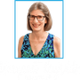 Margaret Reynolds wearing glasses and a blue and green dress