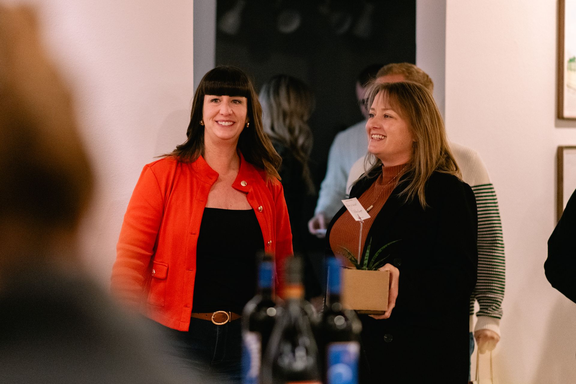 Guests smiling at the gallery