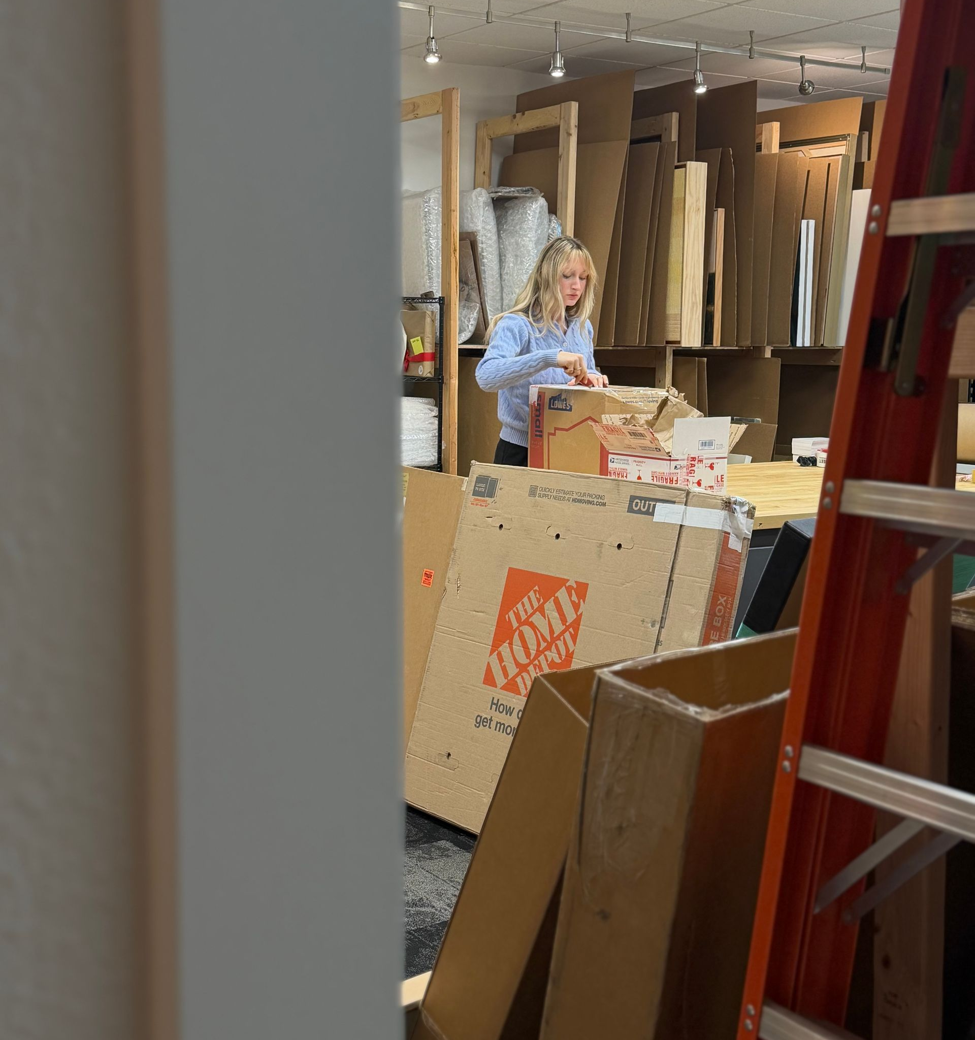 Lily opening boxes