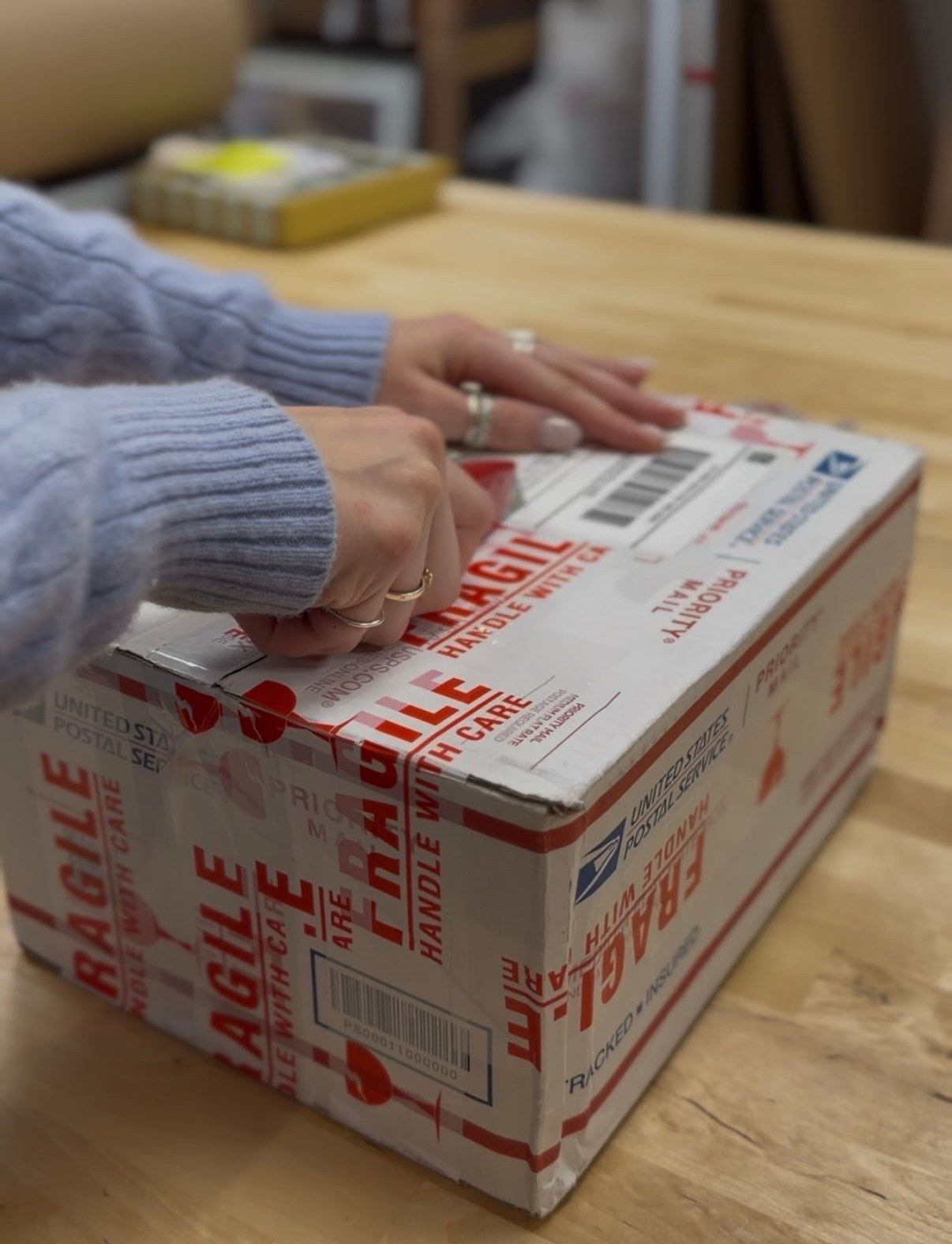 Lily cutting open the box