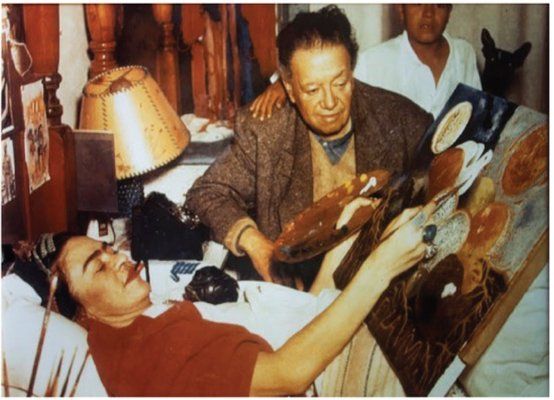 Frida Kahlo painting “Naturaleza viva” (Living Nature) in bed, with Diego Rivera at her side Photograph by Juan Guzman