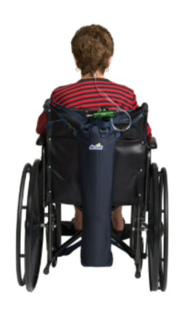 Person seated in a wheelchair, viewed from behind, wearing a red striped shirt