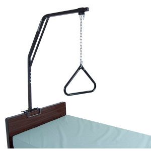 Hospital bed trapeze bar with triangular handle hanging above the bed.