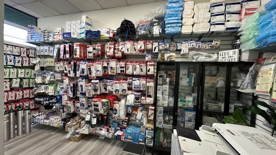 Retail store aisle with shelves of packaged medical supplies and wound-care products Retail store aisle with shelves of packaged medical supplies and wound-care products