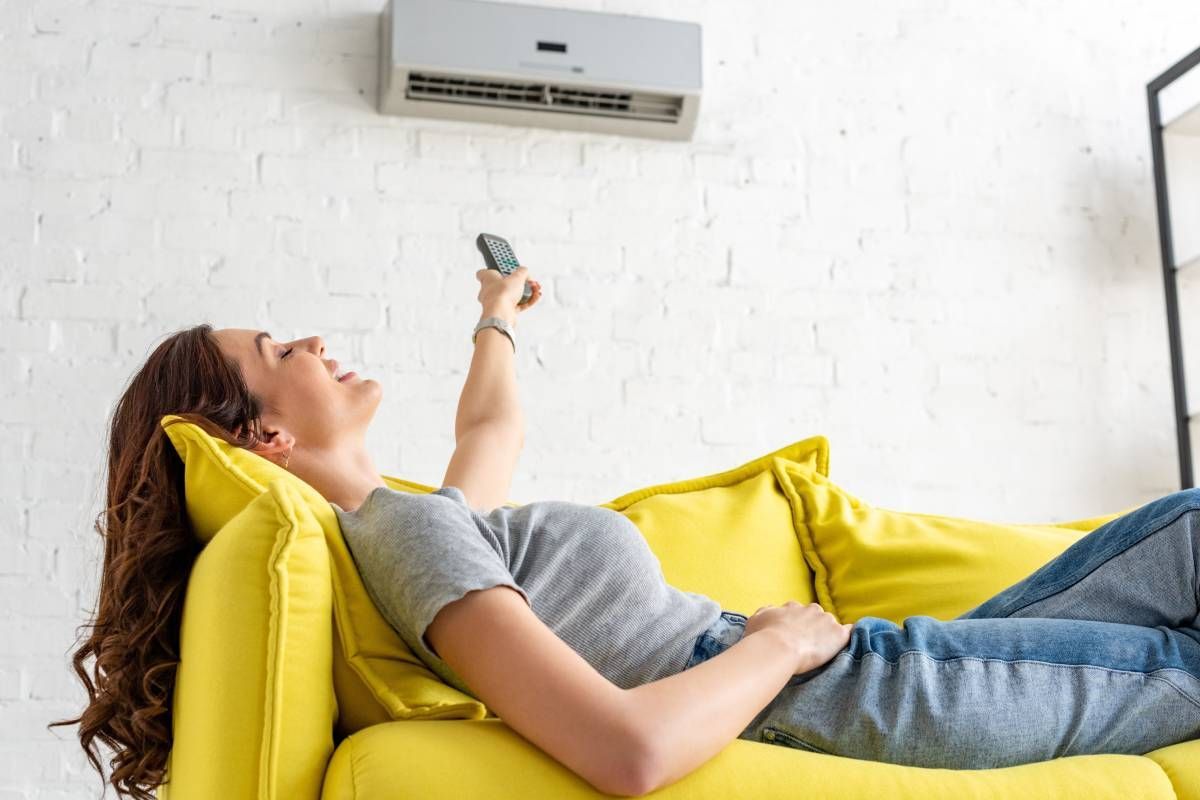 Women Relaxing on a Couch Under an Air Conditioner near Lexington, KY