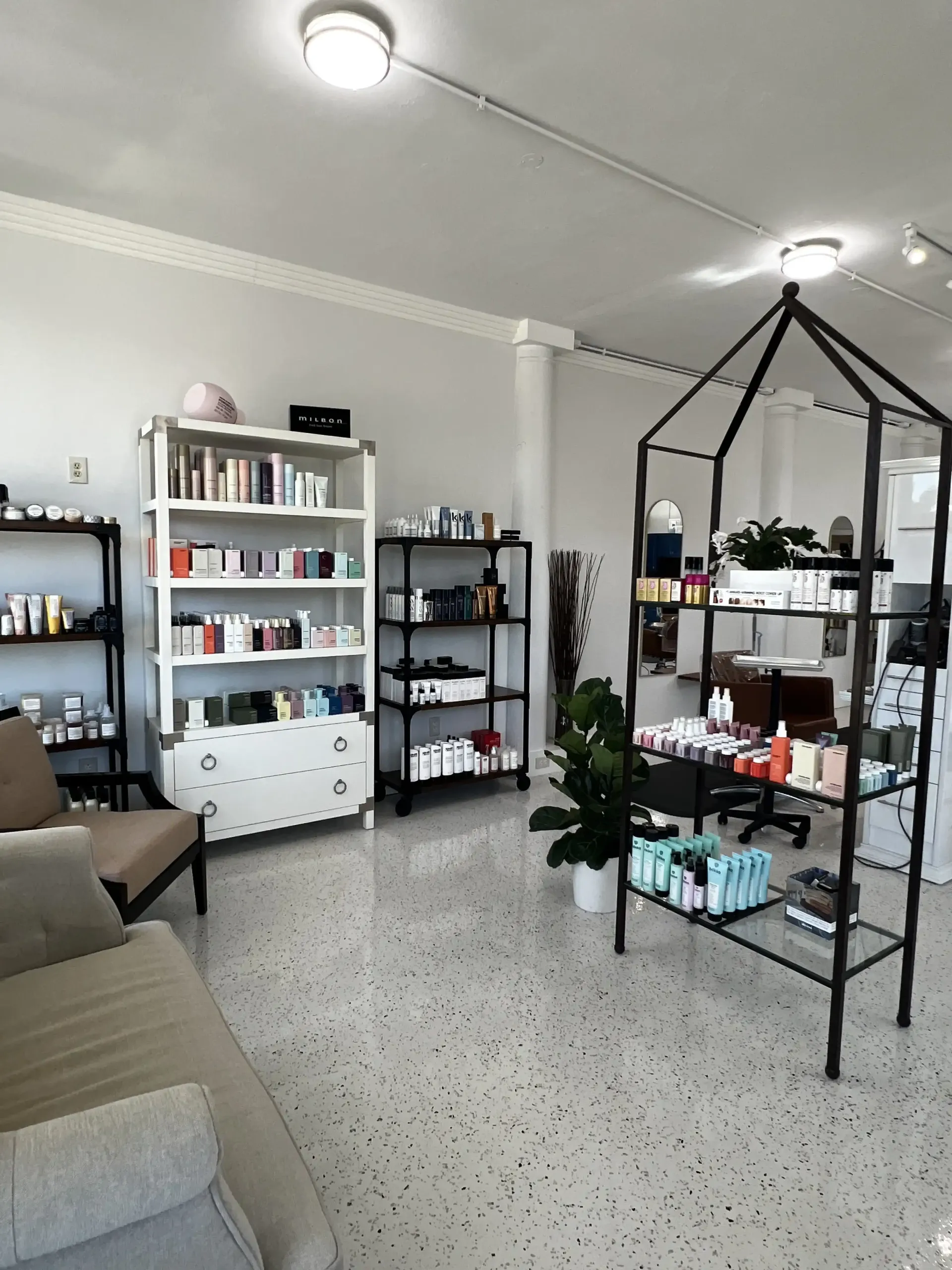 A room with a lot of shelves and a couch