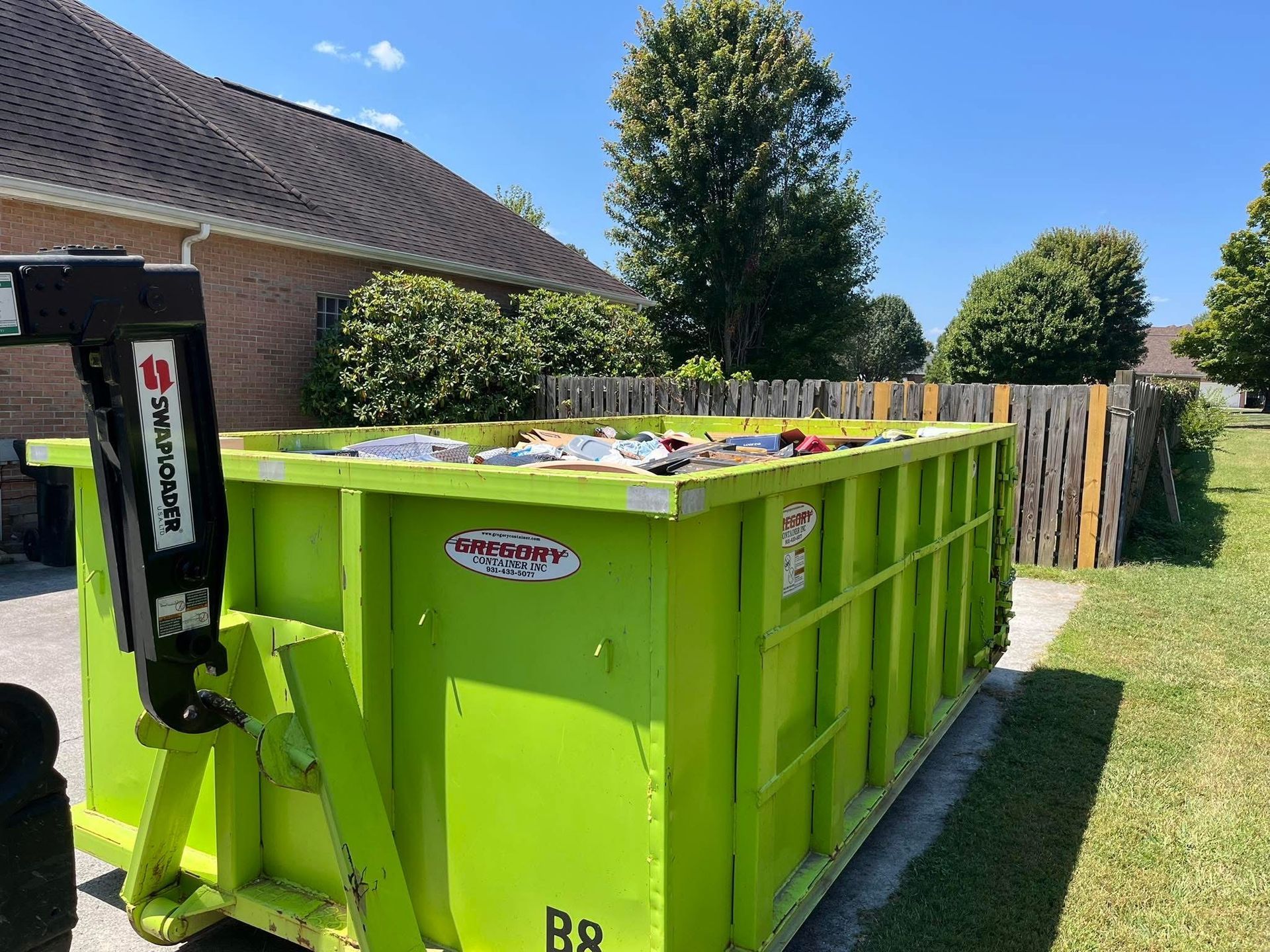 Dumpster rental truck on site