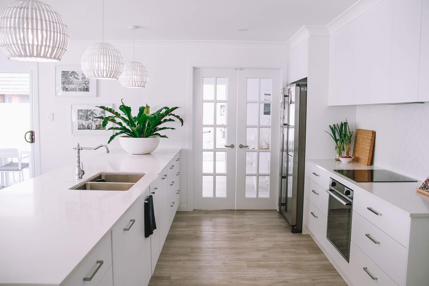 Kitchen with White Cabinets and A Refrigerator — Beith Building & Developments Pty Ltd In Hope Island, QLD