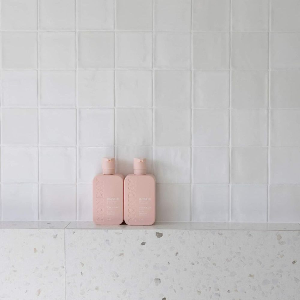 Two Pink Bottles Are Sitting on A Shelf in A Bathroom — Beith Building & Developments Pty Ltd In Burleigh Heads, QLD