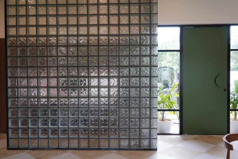 A Room with A Glass Wall and A Green Door — Beith Building & Developments Pty Ltd In Burleigh Heads, QLD