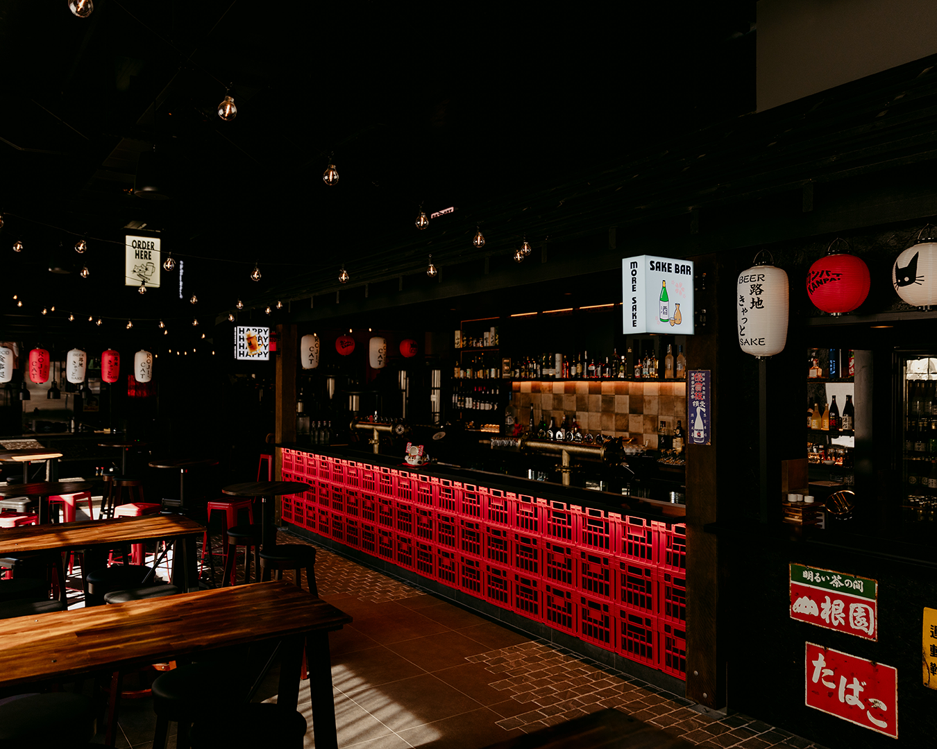 A restaurant with a long red counter and tables and chairs. — Beith Building & Developments Pty Ltd In Burleigh Heads, QLD