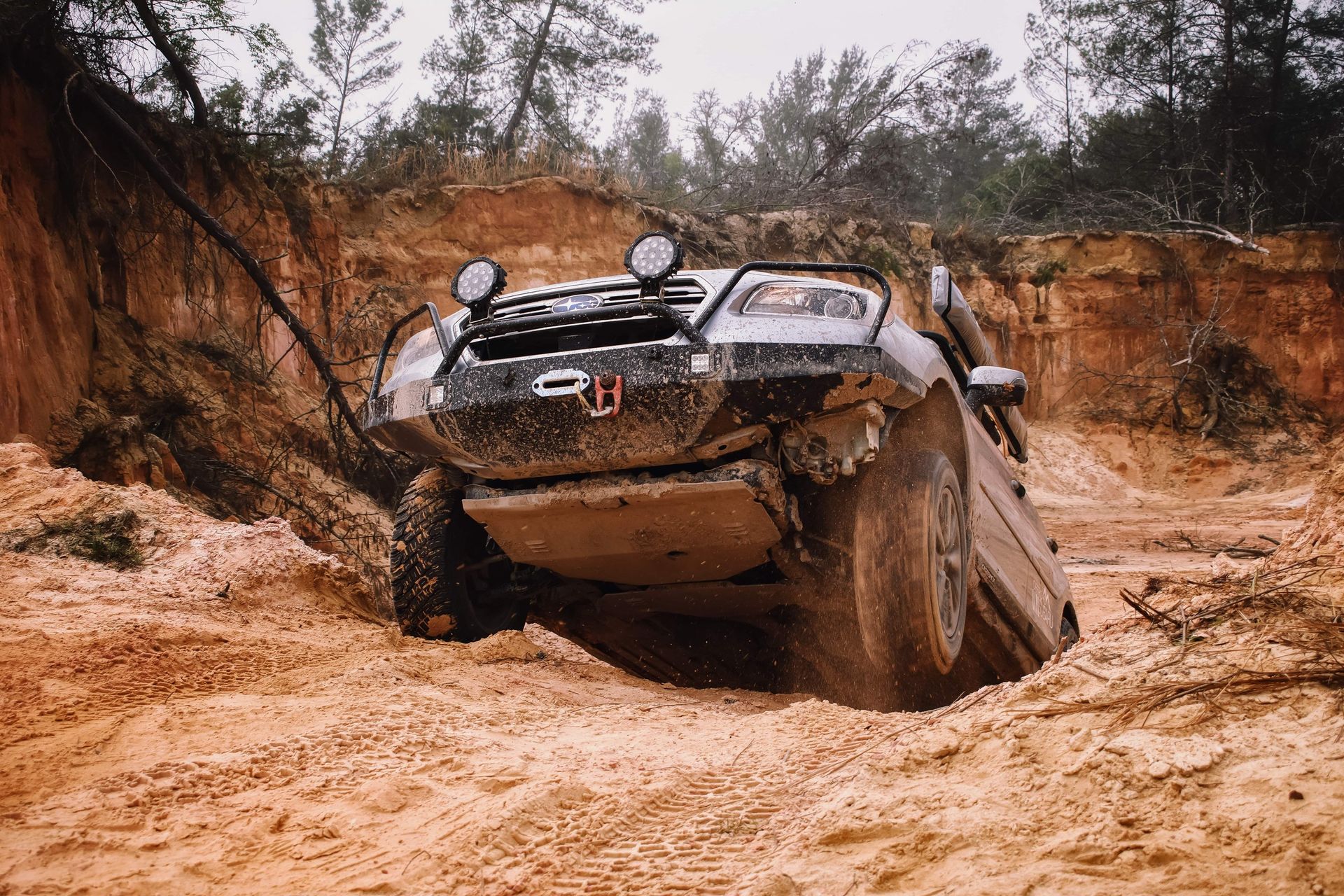 Modified 4WD vehicle tackling challenging off-road terrain
