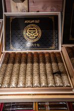 Cedar-lined humidor shelves filled with cigar boxes