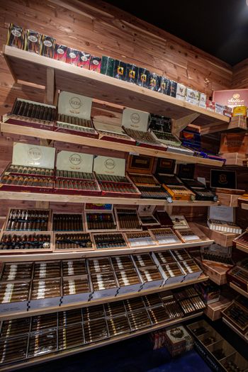 Inside the walk-in humidor with rows of hand-rolled cigars