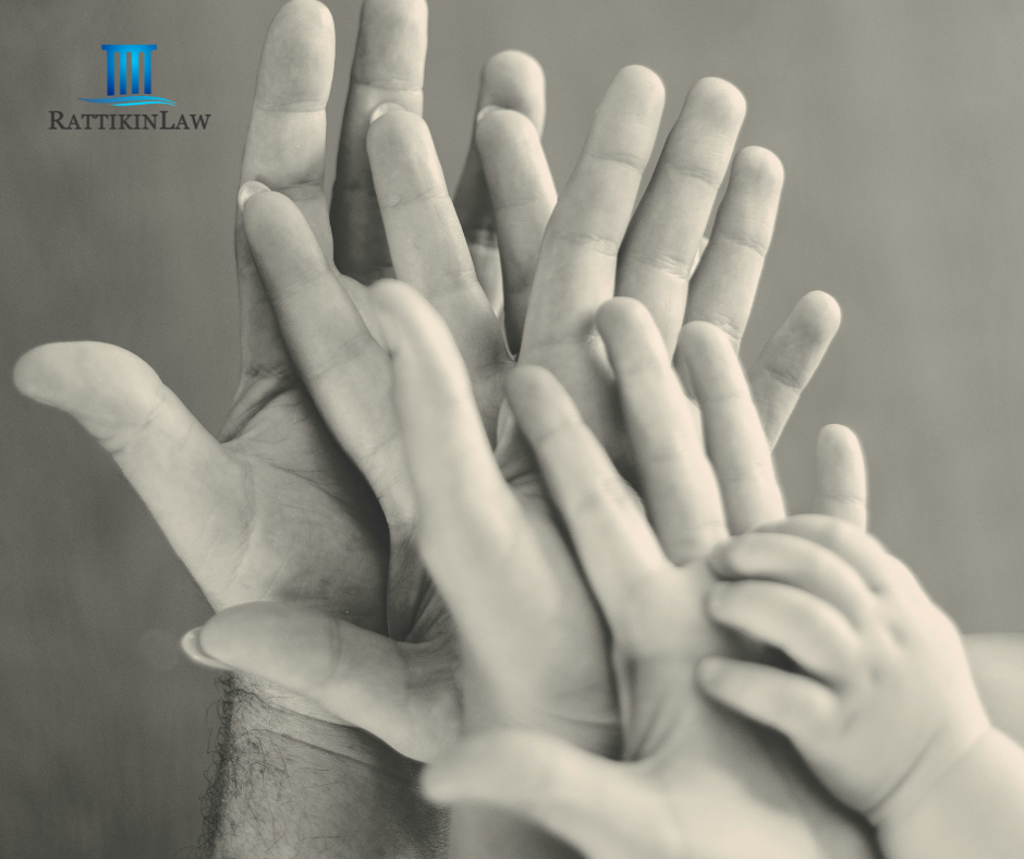 Hands of family members