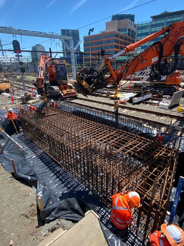 A group of construction workers are working on a bridge under construction.