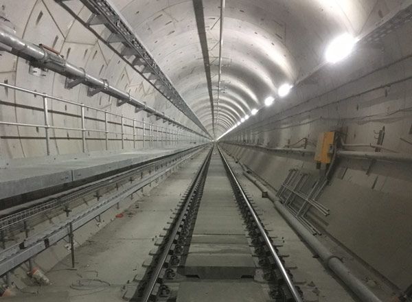 A train tunnel with tracks going through it