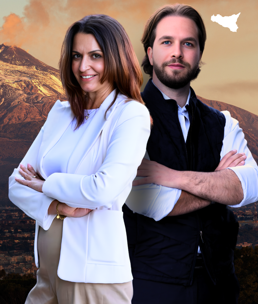 Two people standing back to back with arms crossed against a mountain sunset backdrop