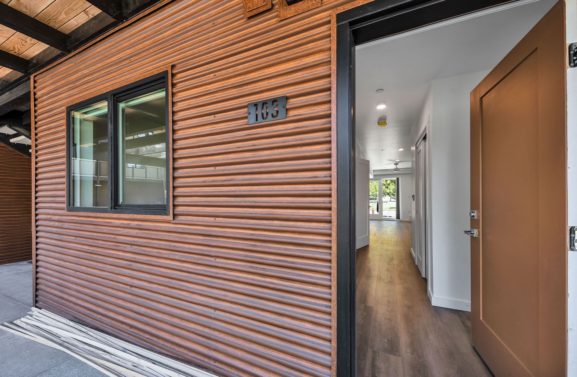 A house with a wooden siding and a wooden door