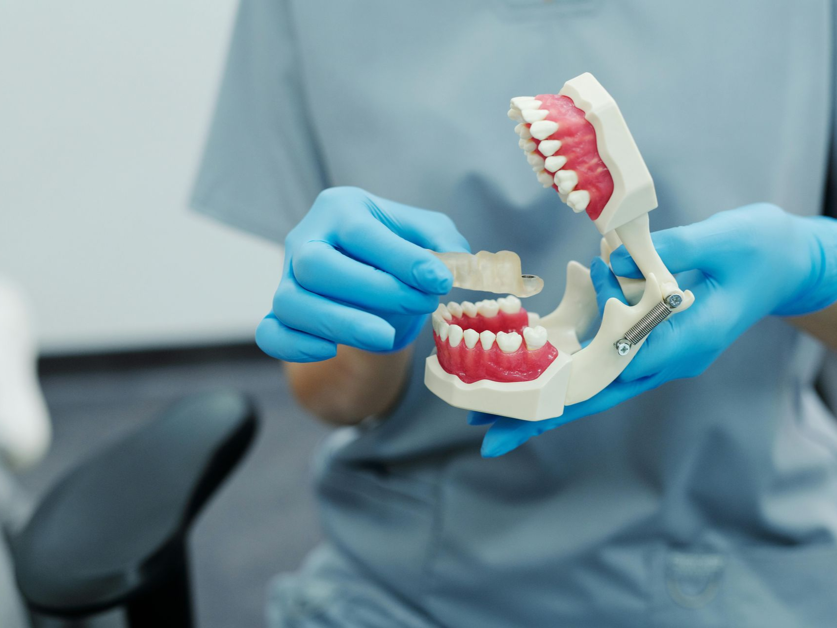 Applying dental sealant to a child’s molar at Hallmark Dental