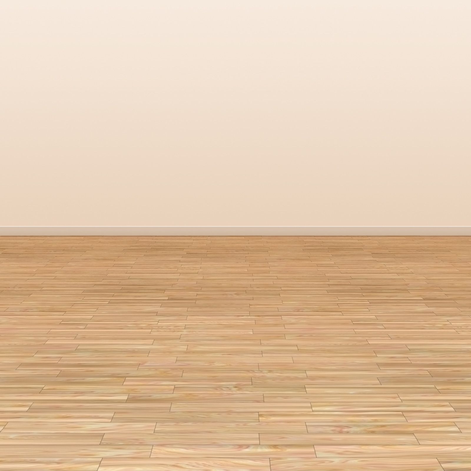 Empty room with light wood flooring and a beige wall