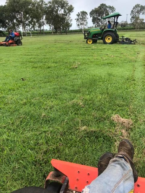 First-person View of a Tractor Mowing a Grassy Field — Everyday Maintenance Pty Ltd In Beaconsfield, QLD