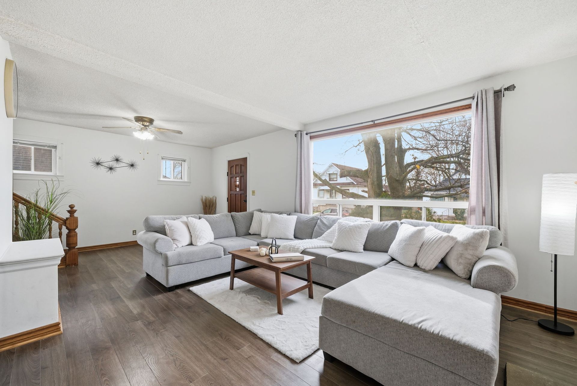 Bright living room with large windows and natural light, Oshawa property by Laura Cooper Realtor