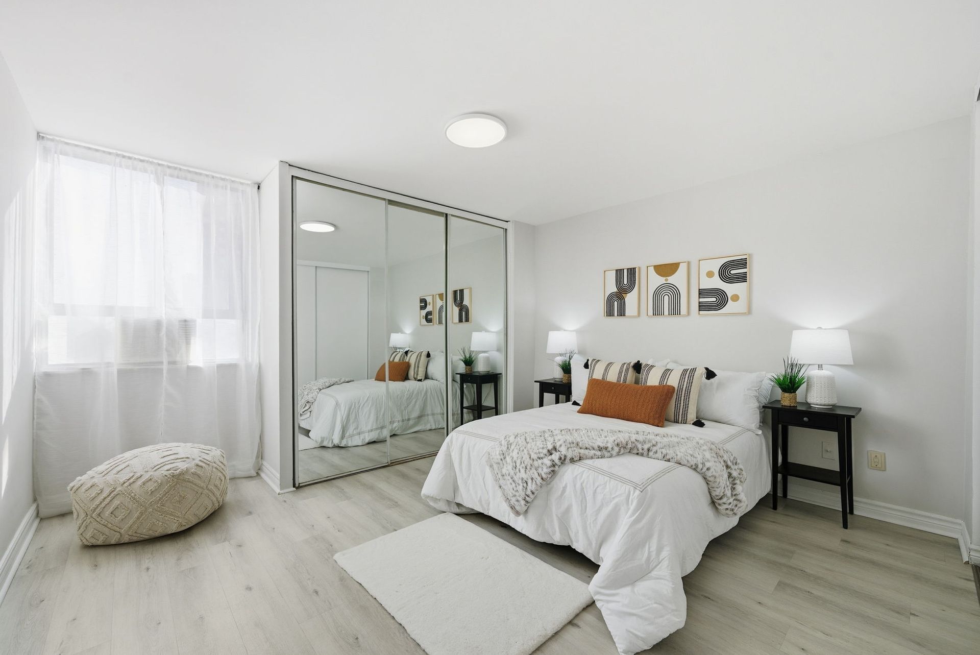 Primary bedroom with corner exposure and natural light, listed by Laura Cooper Realtor