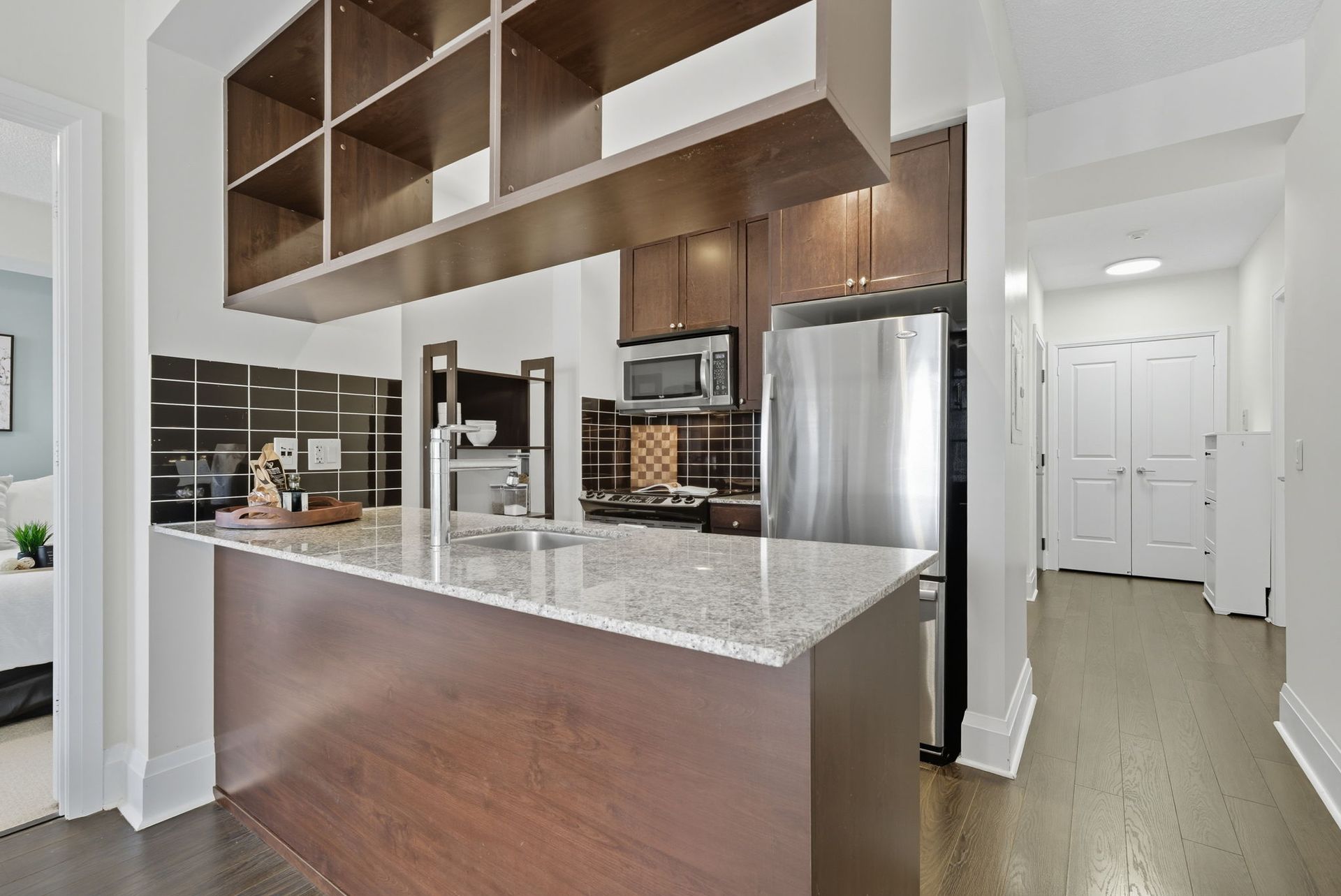 Modern kitchen with stainless steel appliances, 1808 condo by Laura Cooper Realtor