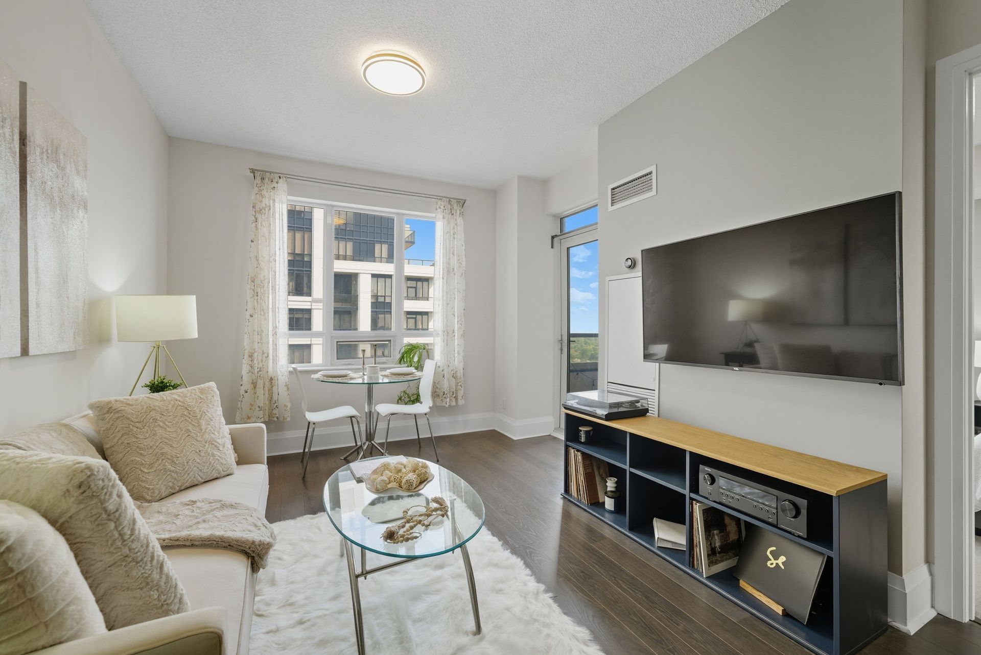 Living room with laminate floors and views, Laura Cooper Realtor Toronto condo listing