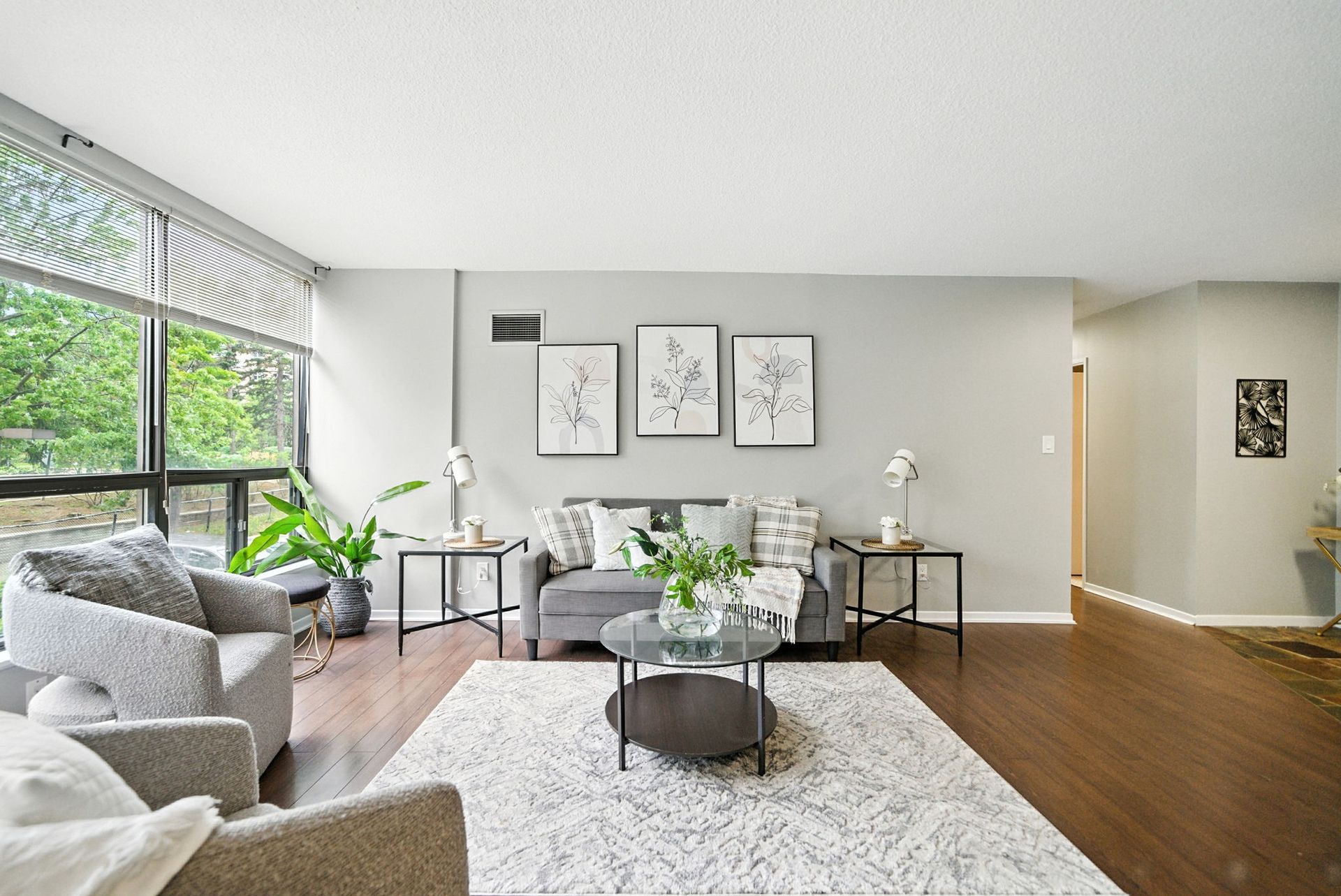 Open‑concept living and dining room with natural light, Laura Cooper Realtor Mississauga listing