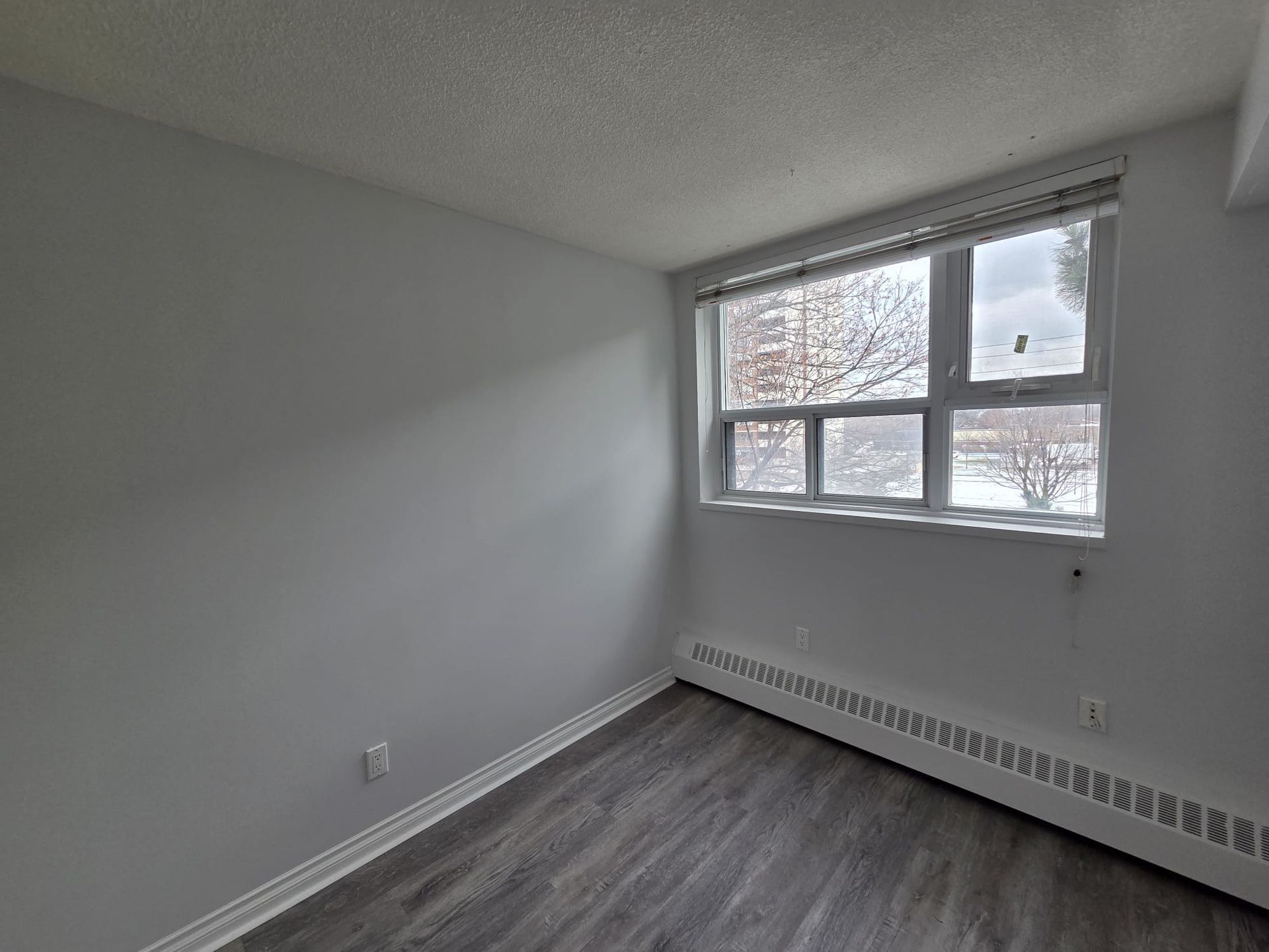 Third bedroom with large window and closet, listed by Laura Cooper Realtor