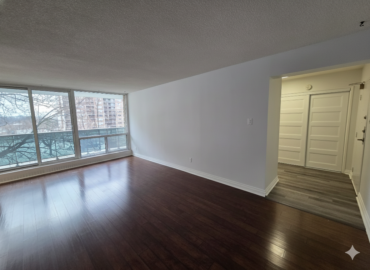 Living space showing large windows and laminate/vinyl flooring, listed by Laura Cooper Realtor