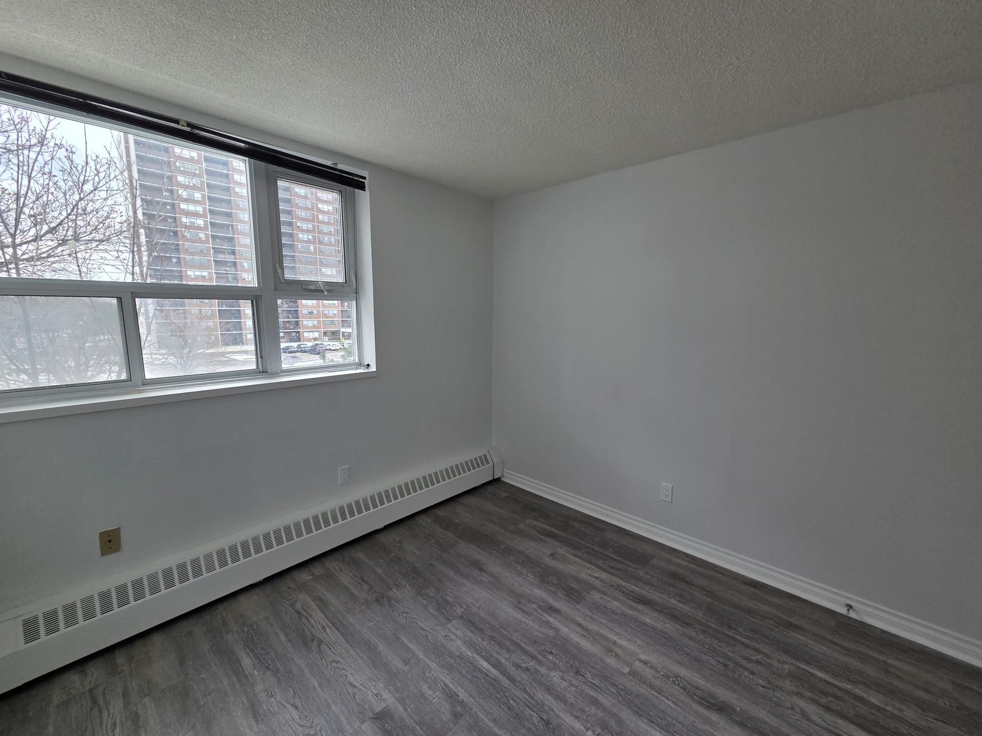 Third bedroom with large window and closet, listed by Laura Cooper Realtor