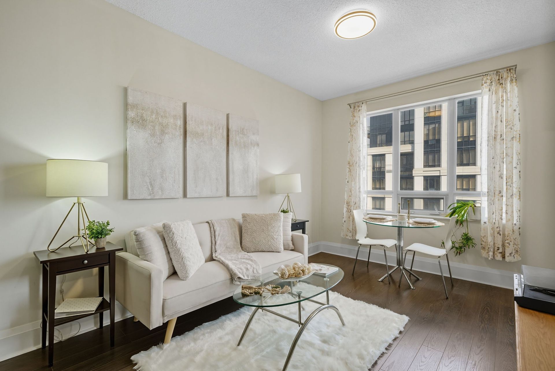 Open-concept living with balcony access, listed by Laura Cooper Realtor
