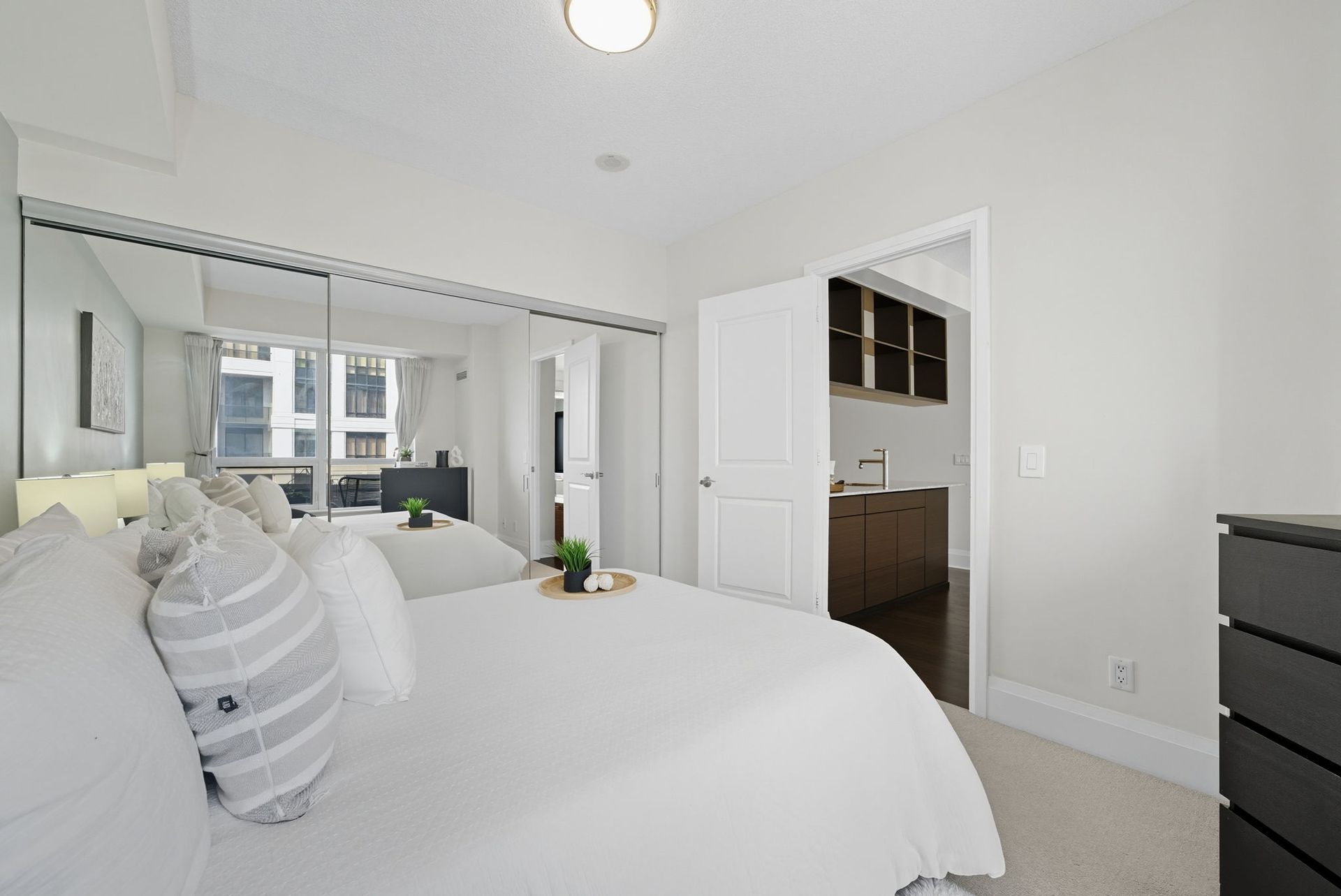 Primary bedroom with custom mirrored closet, 1808 by Laura Cooper Realtor