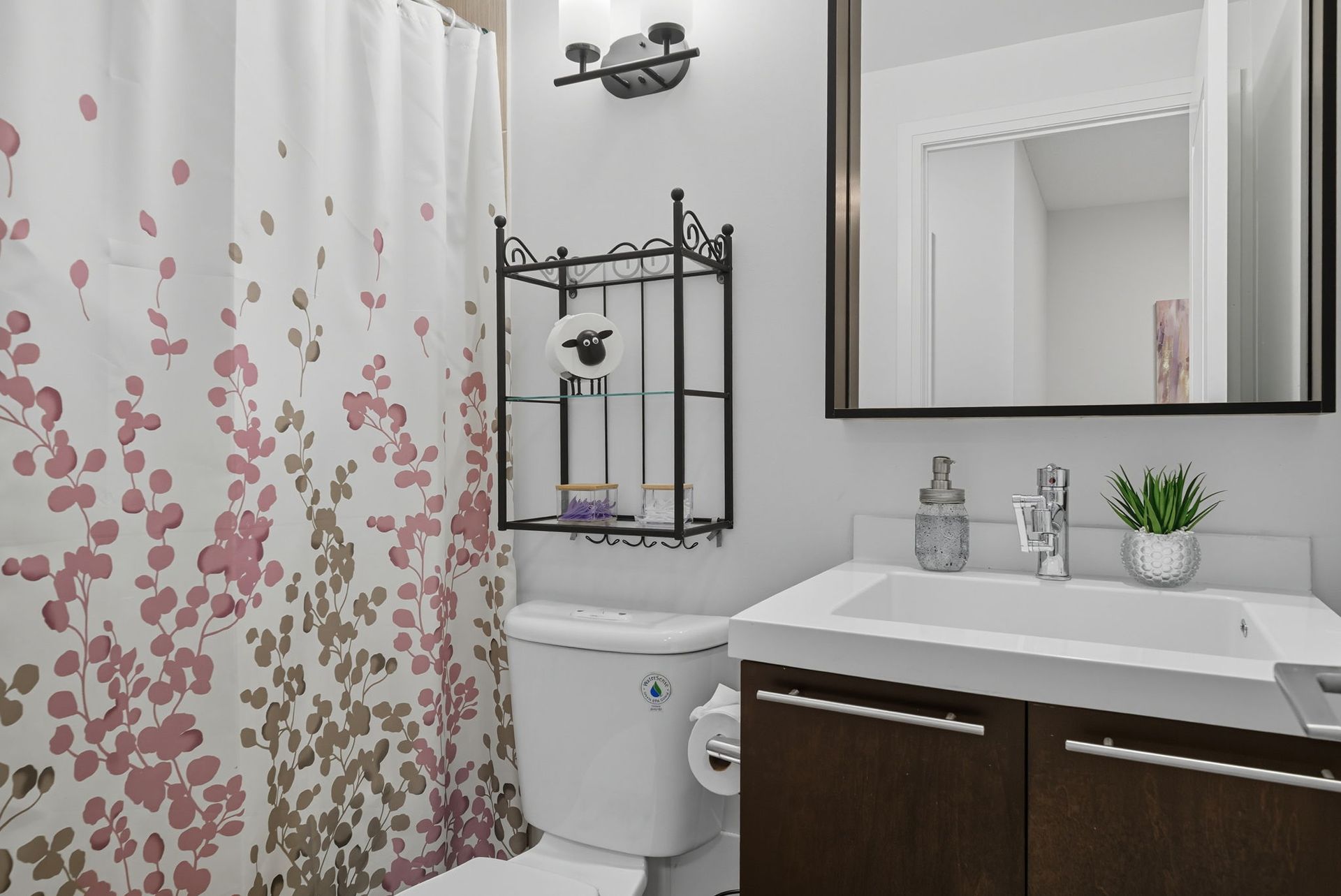 Bathroom vanity and shower detail, listed by Laura Cooper Realtor
