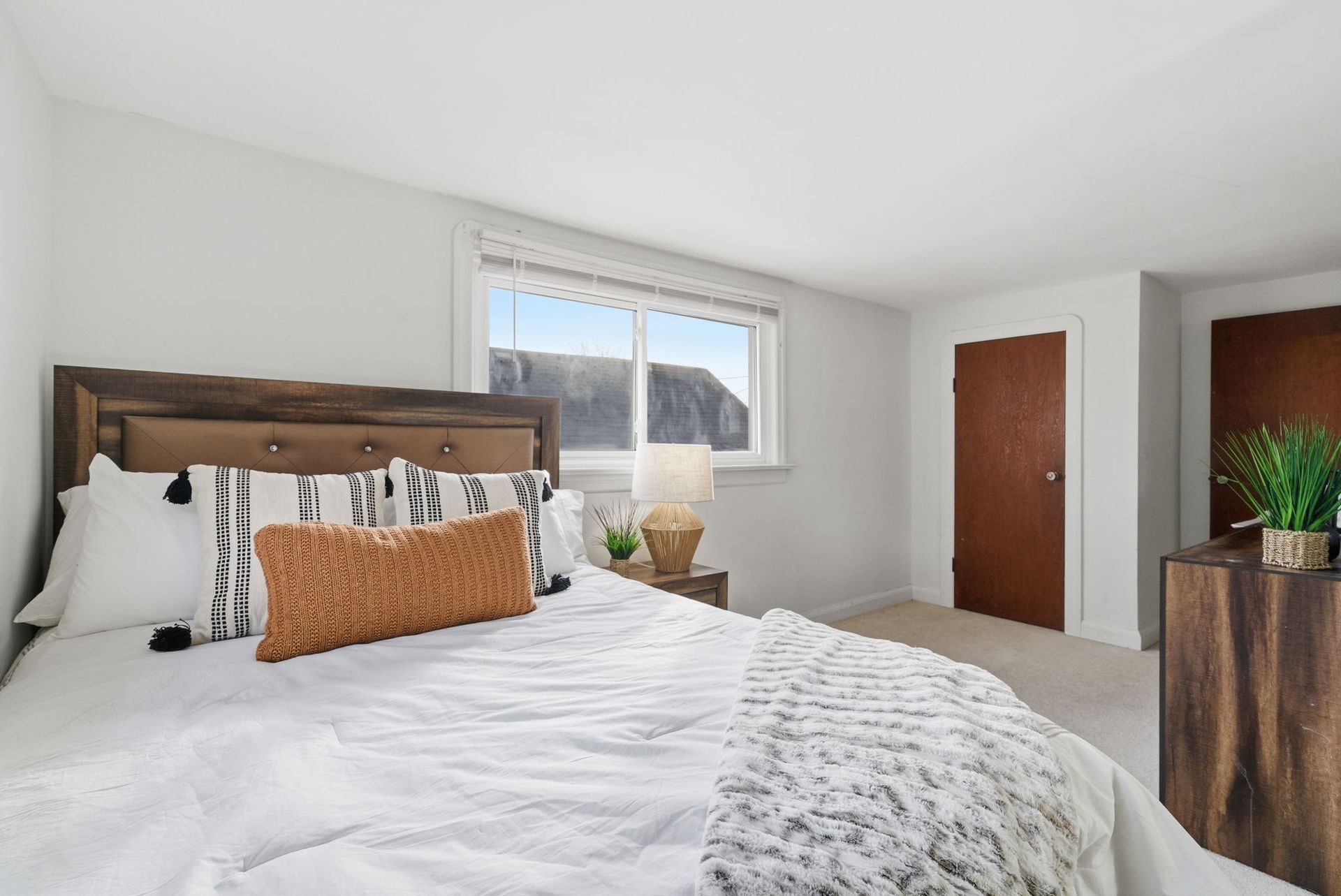 Primary bedroom showing closet and window light, listed by Laura Cooper Realtor