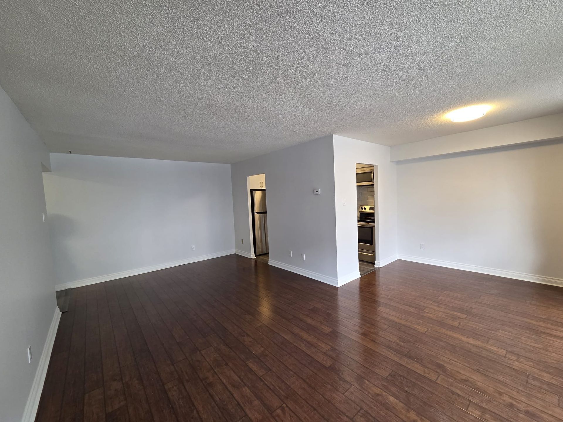 Open concept living and dining area inside unit 314 at 30 Sunrise Ave, by Laura Cooper Realtor