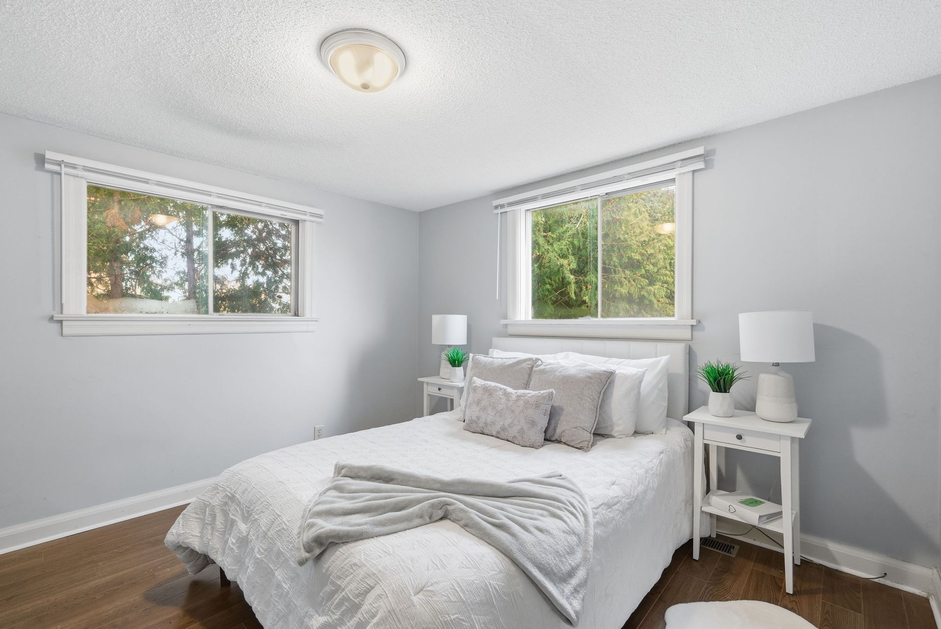 Second bedroom with large window and bright finishes, Oshawa property by Laura Cooper Realtor