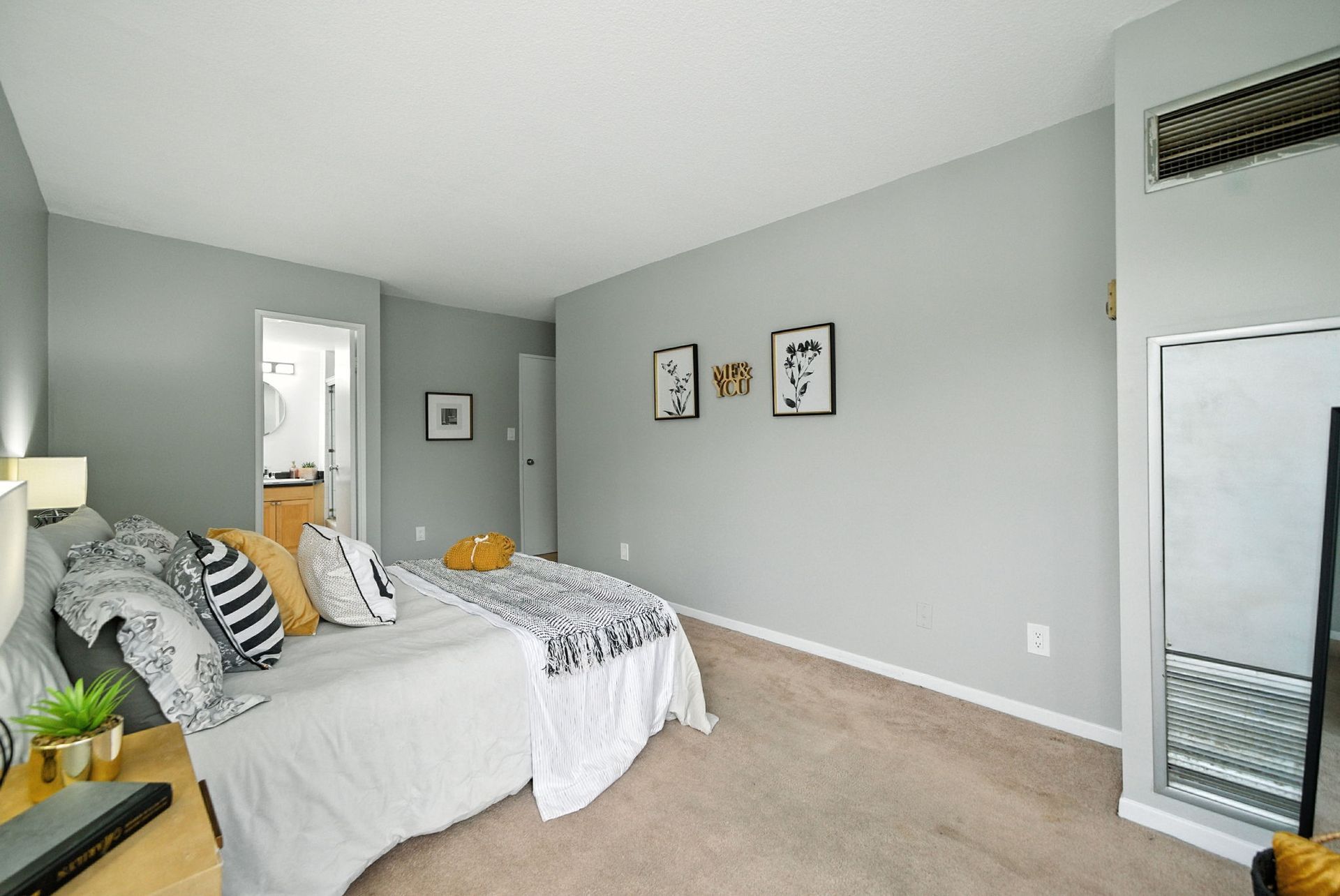 Second bedroom with closet and windows, listed by Laura Cooper Realtor