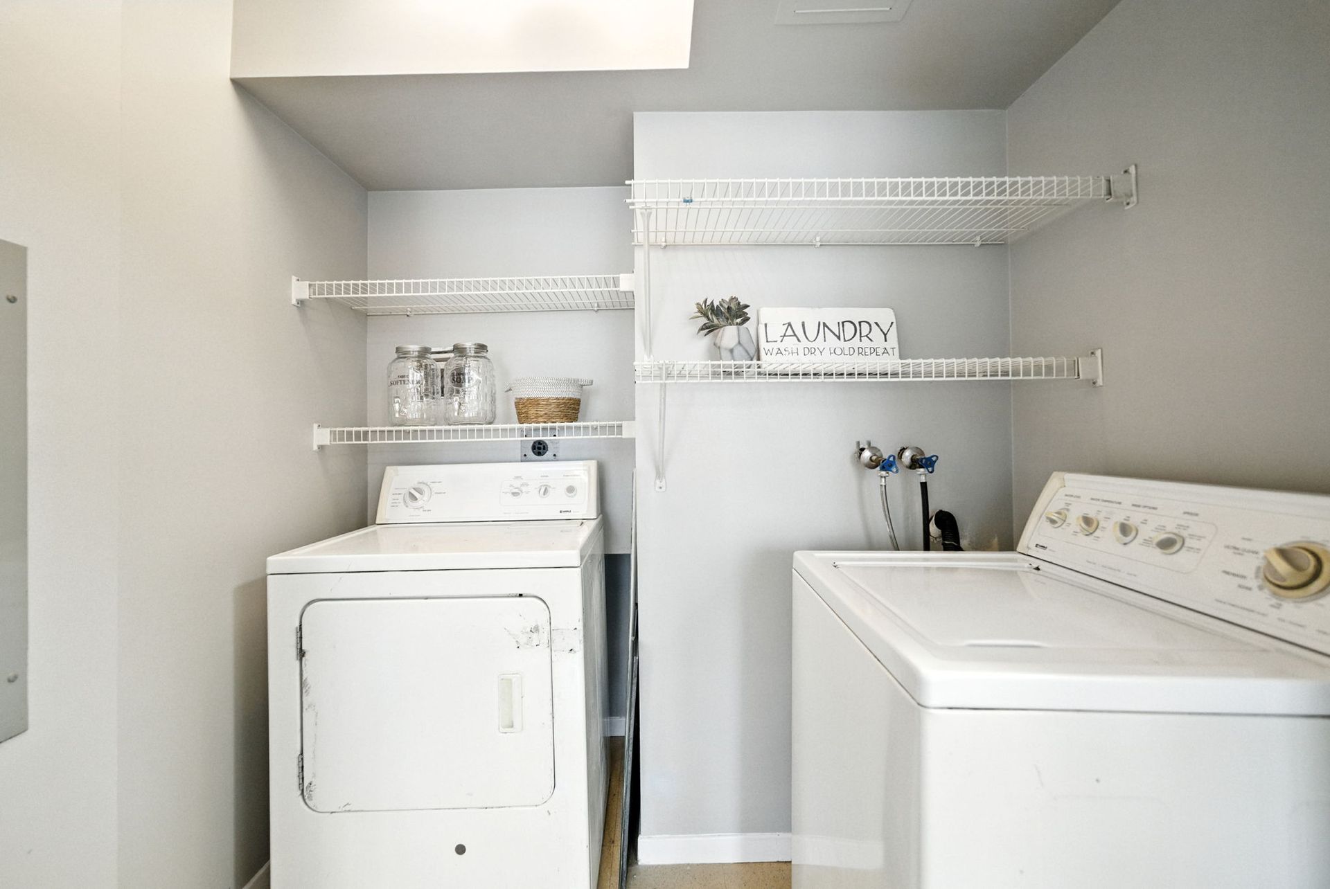 In‑suite laundry area with washer and dryer, Mississauga condo by Laura Cooper Realtor